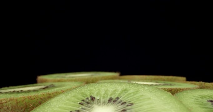 Fresh kiwi fruit cut in half super macro close up shoot fly over laowa k4 high quallity