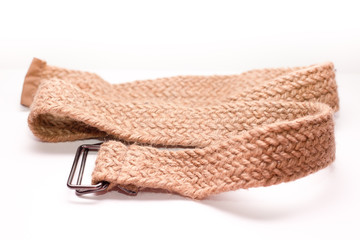 Close-up men's brown woven belt on a white background.