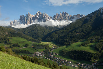 Naklejka na ściany i meble View from the small Italian mountain town of St. Magdalena in Val di Funes