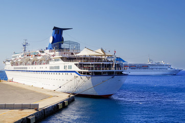 Cruiseships or cruise ship liners in port of Rhodes, Greece during Mediterranean cruising to the...