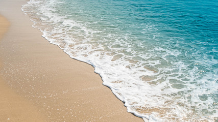 wave of blue ocean on sandy beach. texture Background.