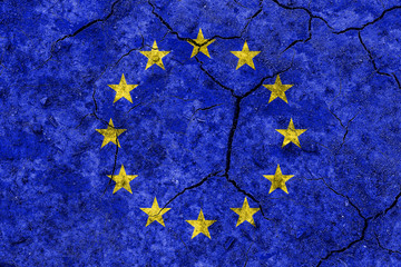 European Union flag on cracked earth texture. The concept of crisis, default, economic collapse,...