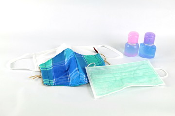 Sanitary mask with hand washing gel on a white background during the covid virus outbreak 19