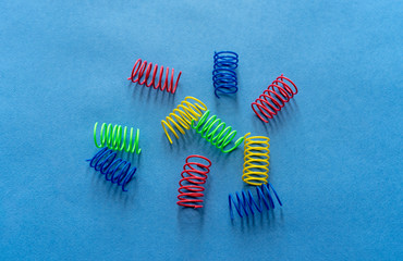 colorfull springs (spiral)  on a blue background