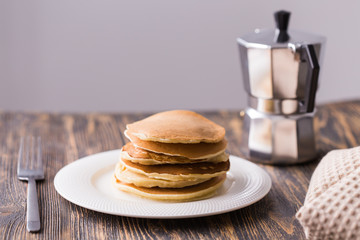 Homemade delicious pancakes on white plate. Breakfast concept