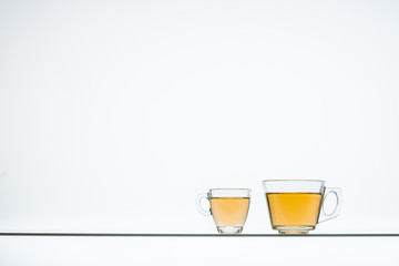 glass cups with hot tea on table, close view    