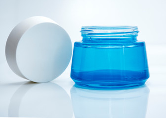 glass blue jar with cream, open lid
