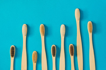 Wooden toothbrushes on a blue background. zero waste concept. dental care without platysik.