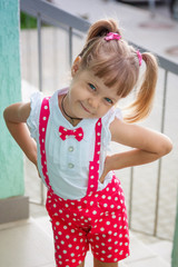 Little girl baby with tails in holiday clothes