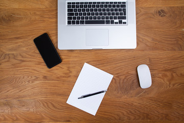 Creative flat lay background, writing, computer and notes