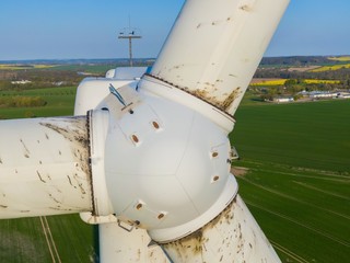 
Wind turbine inspection of the rotors and the turbine close up detail shot with a drone - oil...