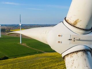 
Wind turbine inspection of the rotors and the turbine close up detail shot with a drone - oil...