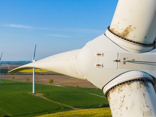 
Wind turbine inspection of the rotors and the turbine close up detail shot with a drone - oil...
