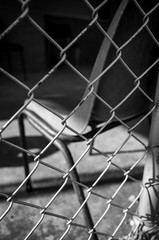 Fototapeta premium Chair behind fence