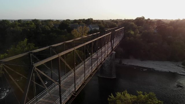 Sunset drone flight over the Faust Street Pedestrian Bridge in New Braunfels, Texas