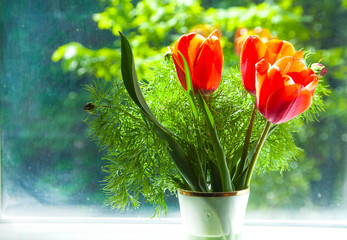 roses on the windowsill. yellow roses in the right corner. roses in the vase. postcard. beautiful flowers.