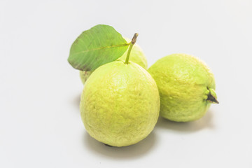 Fresh guava laid out on a white background