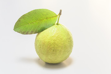 Fresh guava laid out on a white background