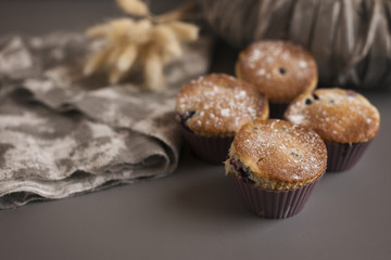  Delicious cupcakes with currants on the table