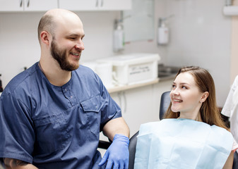 Fototapeta premium Young woman patient waiting treatment in stomatology clinic.