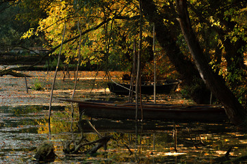 Autumn landscape with fishing boats at the fishing lake