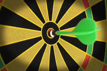 Green sticks to bullseye on a dart board