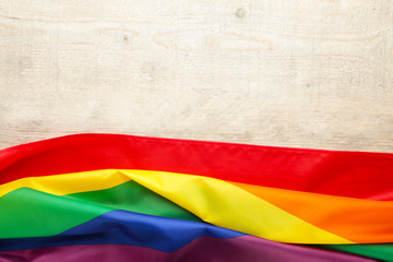 Rainbow LGBT flag on light background with copy space