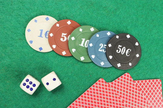 casino elements-dice, chips, cards-a combination of Royal flush on a green felt table - Powered by Adobe
