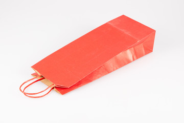 Mockup red paper shopping bootle bag on white background