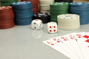 casino elements-dice, chips, cards-a combination of Royal flush, selective focus