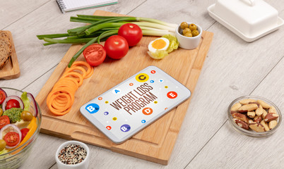 Healthy Tablet Pc compostion with WEIGHT LOSS PROGRAM inscription, weight loss concept