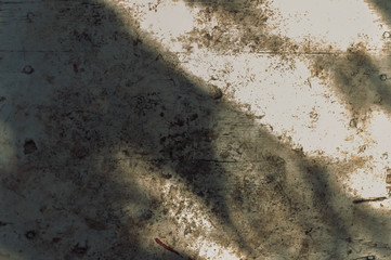 Old gray painted concrete with black scuffed rustic background, horizontal orientation, top view....