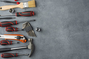 Set of construction tools. Hand tools on a gray background. Free space for an inscription.