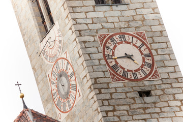 The clock painted and recently restored outside the bell tower of the church in Tiso.