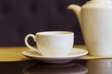 Tea cup and tea pot on table. Breakfast and Five O'Clock Tea. Tea time.