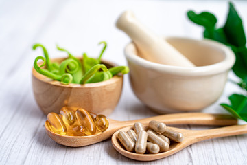 Alternative medicine herbal organic capsule with vitamin E omega 3 fish oil, mineral, drug with herbs leaf natural supplements for healthy good life.