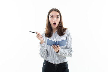 The girl in the striped shirt is surprised by what was written in the diary