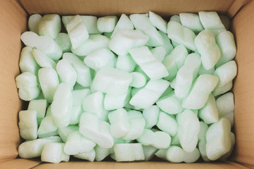 cardboard box filled with polystyrene foam peanuts packaging filler cushioning material