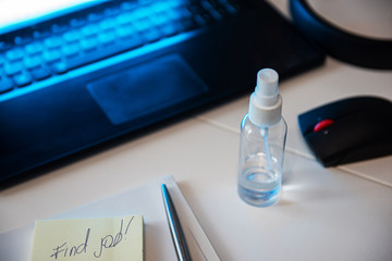 Concept of loss and searching job by reason of coronavirus covid-19. Sanitizer anti virus spray on...