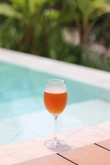 Cold Beer In Glass With Green Background.