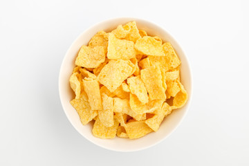 Chips made of corn on a white background
