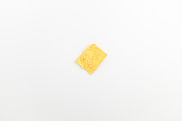 Chips made of corn on a white background