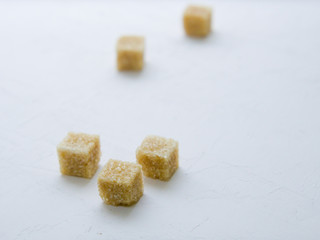 Fototapeta na wymiar Cubes of brown sugar.