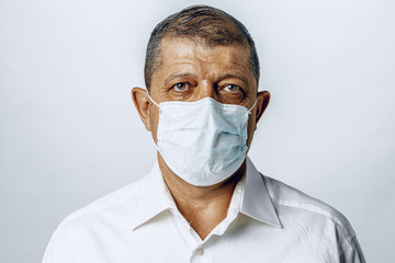 Portrait of a sick adult man in medical mask close up. Coronavirus pandemia concept