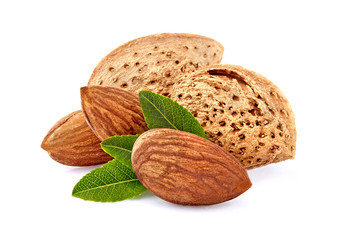 Almonds with leaves in closeup isolated on white background.