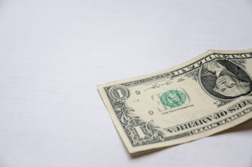 Inverted one dollar on a white background.