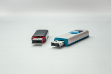 Two different flash drives lying nearby.