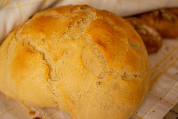 A home made bread on the counter. Warm and crispy homemade bread. bakery