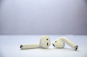 White wireless headphones on a white background.