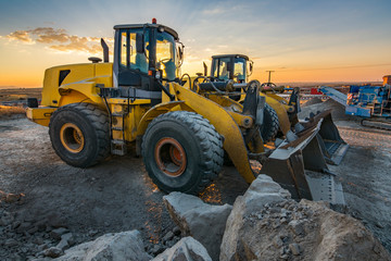 Group of excavators in a rock and stone quarry